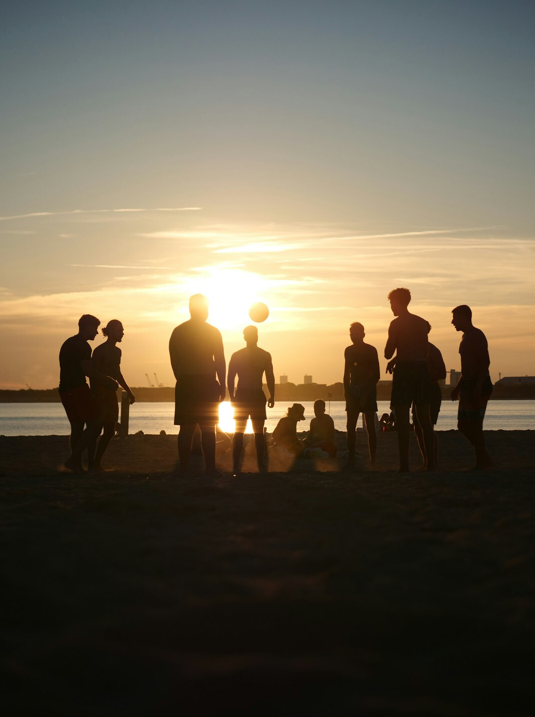 Professionals in a meeting room discussing ideas around a table