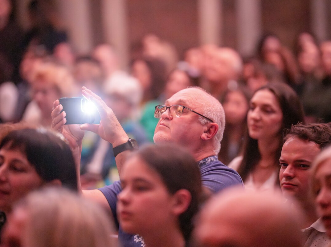 Audience at a conference listening to a presentation